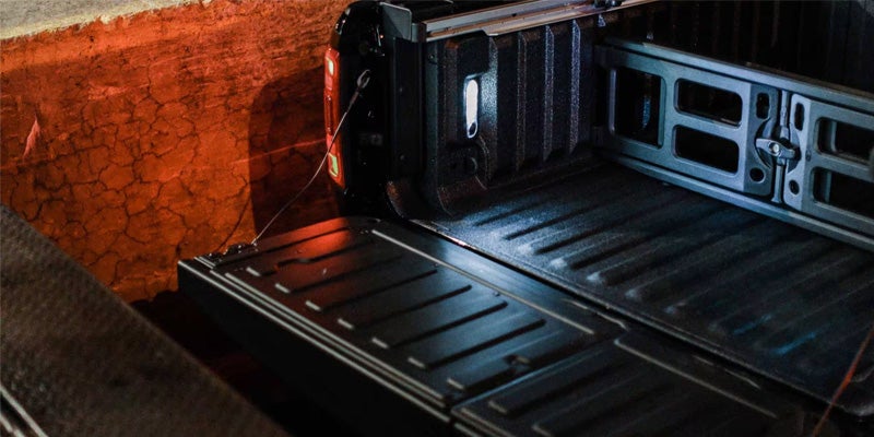 Close-up image of the 2024 RAM 1500 tailgate, showcasing the truck bed light