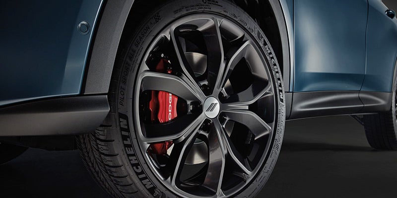 Close-up image of the 2024 Dodge Hornet back passenger wheel