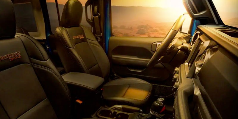 Image of the interior landscape of the 2024 Jeep Wrangler 4xe, showcasing the driver's seat